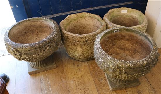 A pair of reconstituted stone garden pedestal urns and a pair of hexagonal planters, diameter 40cm, H.33cm and planters H.29cm